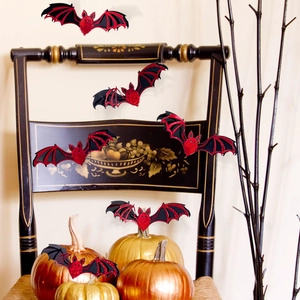 Detailed view of 3D red and black glitter bat wall stickers for Halloween party decoration
