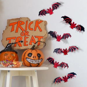 3D double-layer Halloween bat wall stickers with red wing patterns on a white festive wall
