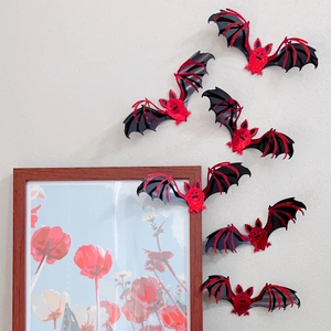3D 3D laser-cut bats with red glitter accents on wings for Halloween wall decoration