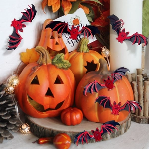 Detail view of 3D layered red and black glitter bat wall stickers for Halloween decor