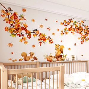 Watercolor fall wall stickers with squirrels and autumn leaves above a wooden crib