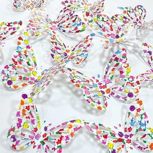 Detailed view of 3D rainbow butterfly wall stickers with vibrant floral patterns