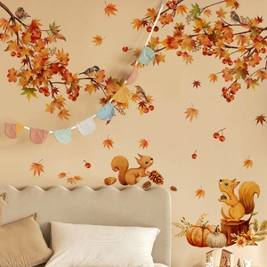 Detailed view of watercolor autumn wall stickers with squirrels and maple leaves in a bedroom
