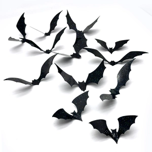 Detailed view of 3D black Halloween bat wall stickers with blue-green glitter and creases