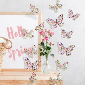 Detailed view of 3D rainbow floral butterfly stickers on a white wall and wooden frame