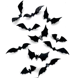 Macro detail of 3D black laser glitter bat wall stickers with reflective shimmering finish