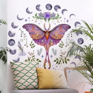 Bohemian wall sticker with purple moth, floral accents and moon phase cycle over a sofa