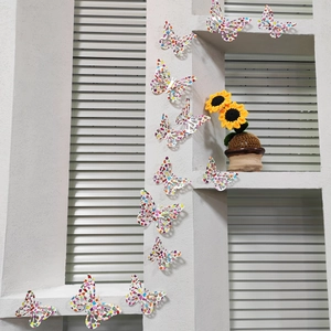 Macro detail of 12pcs 3D rainbow butterfly wall stickers with vibrant floral patterns