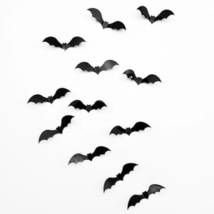 Detail of 3D black laser-cut bats with foldable wings for spooky Halloween wall decor