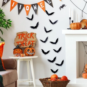 3D black bats wall stickers displayed on a living room wall for Halloween decoration