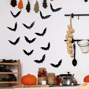 Detailed view of 3D black bat wall stickers with folding wings for Halloween decor