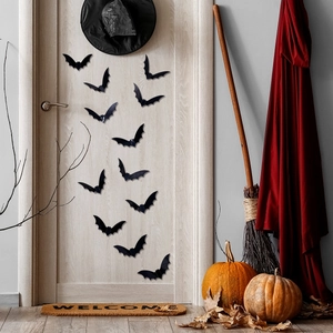 Detailed view of 3D bat wall stickers on a door with festive Halloween decorations