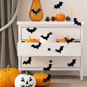 3D black bat wall stickers for Halloween decor with diverse sizes on a white cabinet