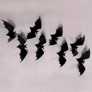 Detailed 3D black decorative bats with wings folded for realistic flying wall art effect
