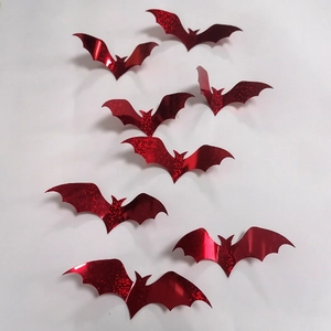 Detailed view of 3D glittery red bat wall stickers with fold lines for party decor