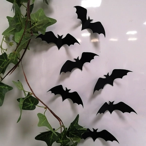 Detailed view of 3D black laser bats with foldable wings for Halloween wall decoration