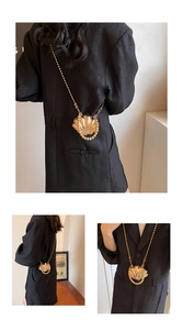Detailed views of gold shell-shaped mini clutch with beaded chain and metallic texture