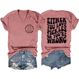 Flat lay of pink V-neck T-shirt with pickles print and distressed denim shorts