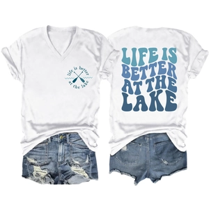 Detail view of Life is Better at the Lake print on a white V-neck T-shirt and denim shorts