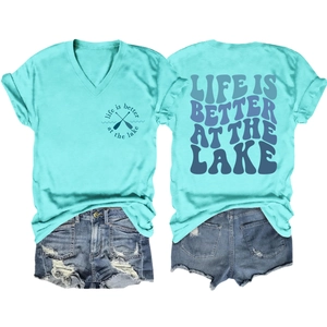 Detail of mint green V-neck T-shirt with Lake graphic and distressed denim shorts set