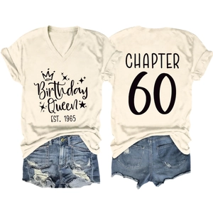 Flat lay of cream V-neck T-shirt with Birthday Queen EST. 1965 and Chapter 60 back print