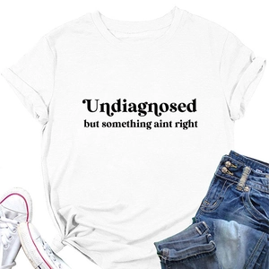 Flat lay detail of white crewneck t-shirt with black letter print and casual styling
