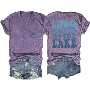 Detail of purple V-neck T-shirt with lake graphic and ripped denim shorts set