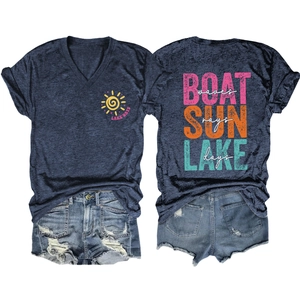 Detailed flat lay of V-neck T-shirt with lake prints and distressed denim shorts