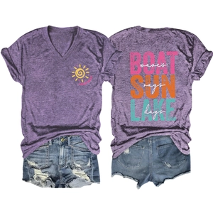 Detail of purple V-neck T-shirt with lake print and distressed denim shorts outfit