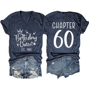 Flat lay of navy V-neck T-shirt with Birthday Queen 60 print and denim shorts