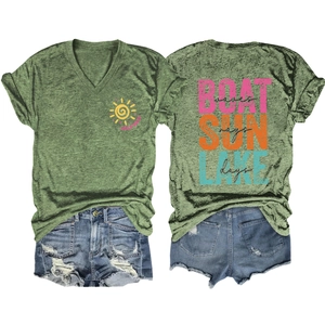 Flat lay view of V-neck t-shirt with Lake Days print and distressed denim shorts