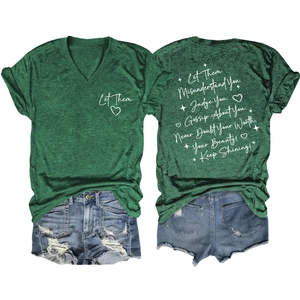 Detail of dark green V-neck T-shirt with white text paired with ripped denim shorts