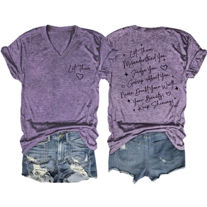 Detailed view of women's purple V-neck T-shirt and denim shorts with inspirational text
