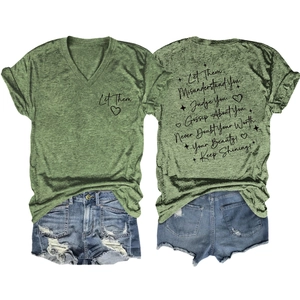 Detailed flat lay of green V-neck T-shirt with inspirational quotes and denim shorts