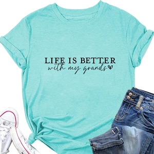 Detail of lake blue t-shirt with knotted hem and Life is Better with my grands print