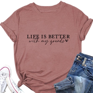 Flat lay of dusty rose cotton T-shirt with LIFE IS BETTER text and casual outfit items