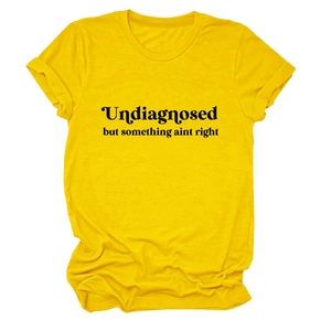 Detail of soft yellow cotton fabric with black slogan print on a casual crew neck T-shirt