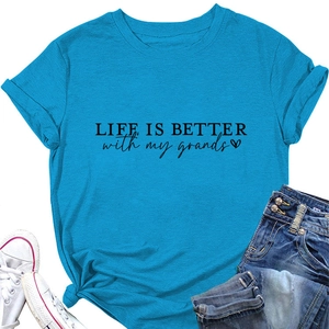 Detail of lake blue t-shirt with Life is Better text and unique side knot hem design
