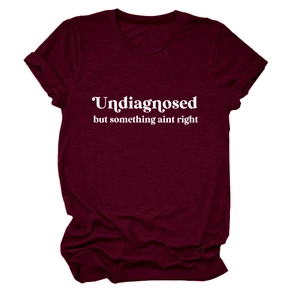 Detail of rolled cuffs and white graphic print on burgundy crew neck cotton T-shirt