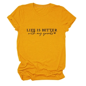 Detail of ginger yellow t-shirt featuring rolled sleeves and Life Is Better slogan print