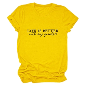 Detail of yellow cotton T-shirt featuring 'LIFE IS BETTER' slogan and heart graphic