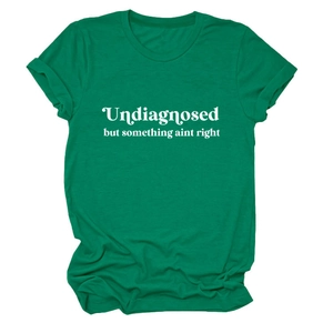 Detail of green crew neck T-shirt featuring white artistic text print and soft cotton texture
