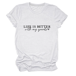 Detail of cotton white T-shirt showing LIFE IS BETTER slogan and heart print detail
