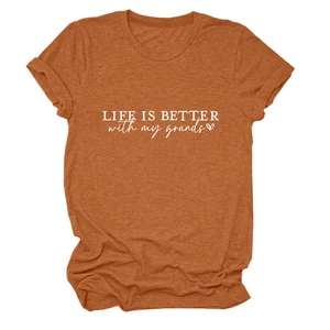 Close-up of rust red cotton t-shirt featuring Life is Better with My Grands white slogan