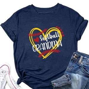 Flat lay of navy blue Softball Grandma T-shirt with baseball heart graphic and denim shorts