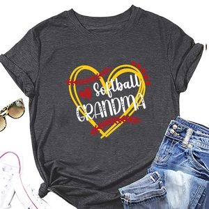 Flat lay of charcoal Softball Grandma T-shirt with heart graphic and lifestyle accessories