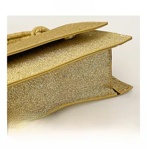 Macro shot of gold sequin texture and side gusset design on this stylish handbag