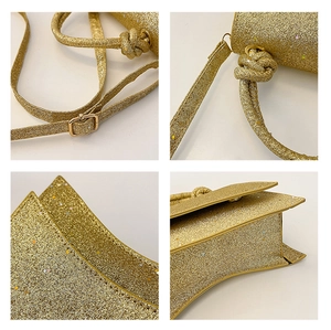 Detail of gold sequin handbag with knot handle and adjustable strap hardware