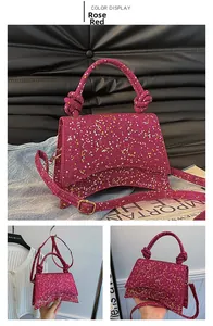 Detail of rose red sequin handbag with star patterns and stylish curved base structure