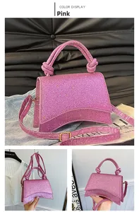 Detail of pink glitter hourglass handbag featuring unique knot handle and sequins